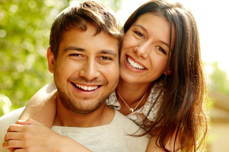 Dental Patients Smiling With Well Cared For Dental Implants In St. Charles, IL