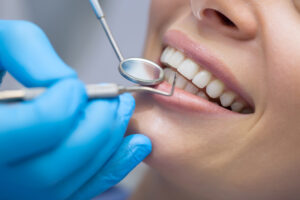 Dentist examining a patient's teeth in the dentist.