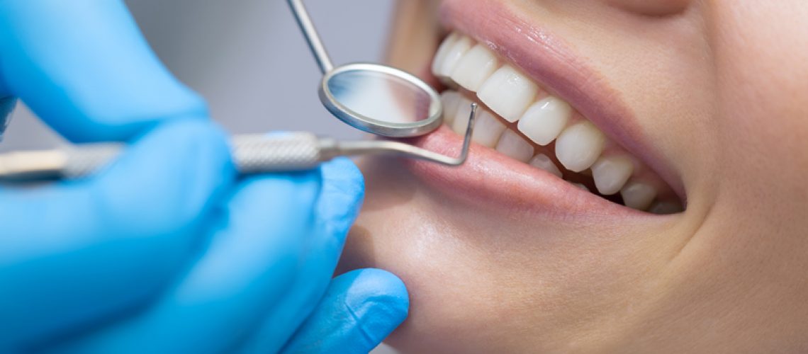 Dentist examining a patient's teeth in the dentist.