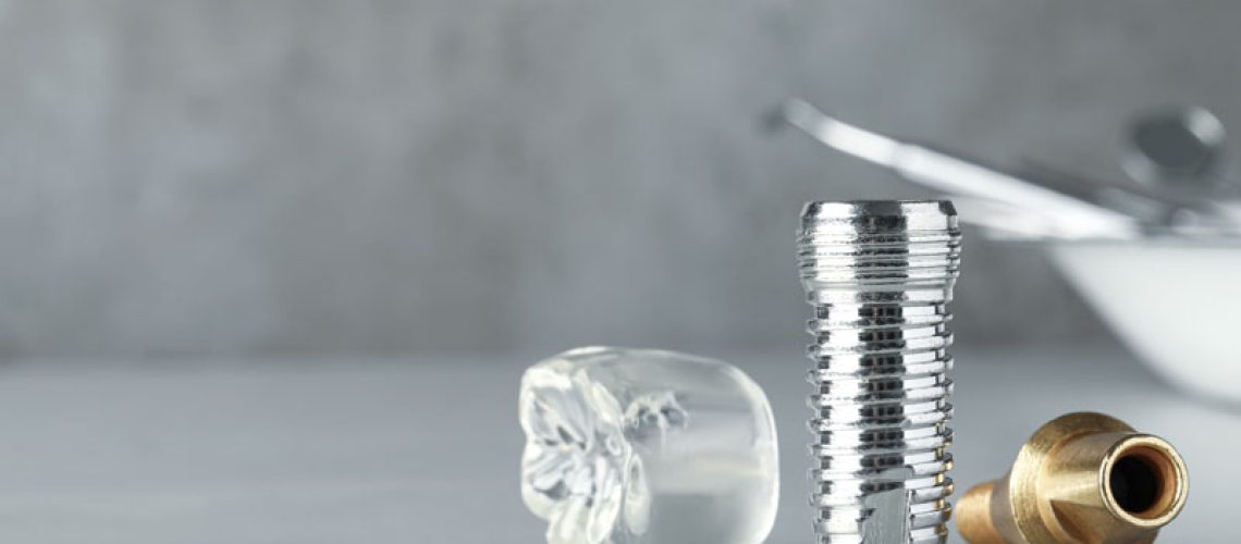 a titanium dental implant post and crown model.