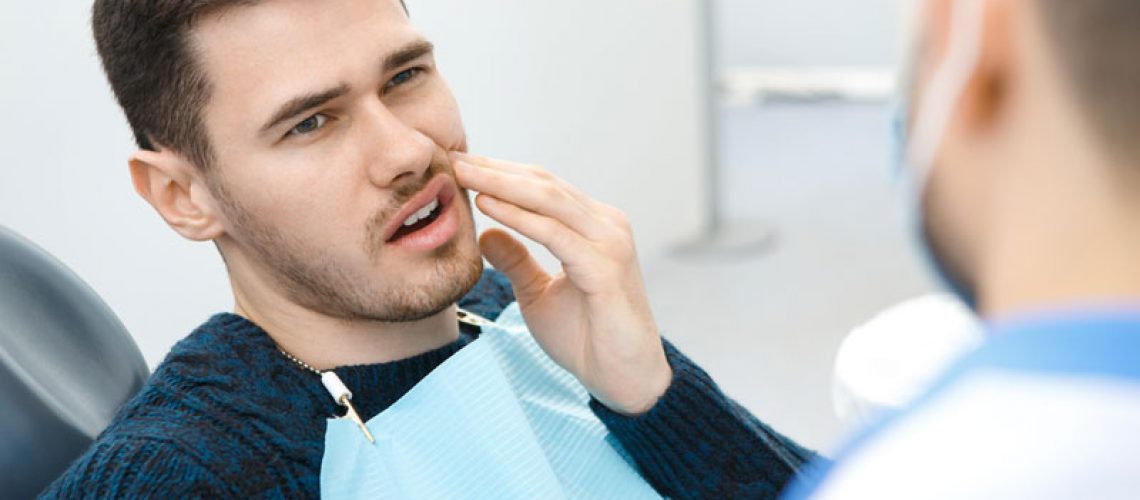 Dental Patient Suffering From Mouth Pain On A Dental Chair, In St. Charles, IL